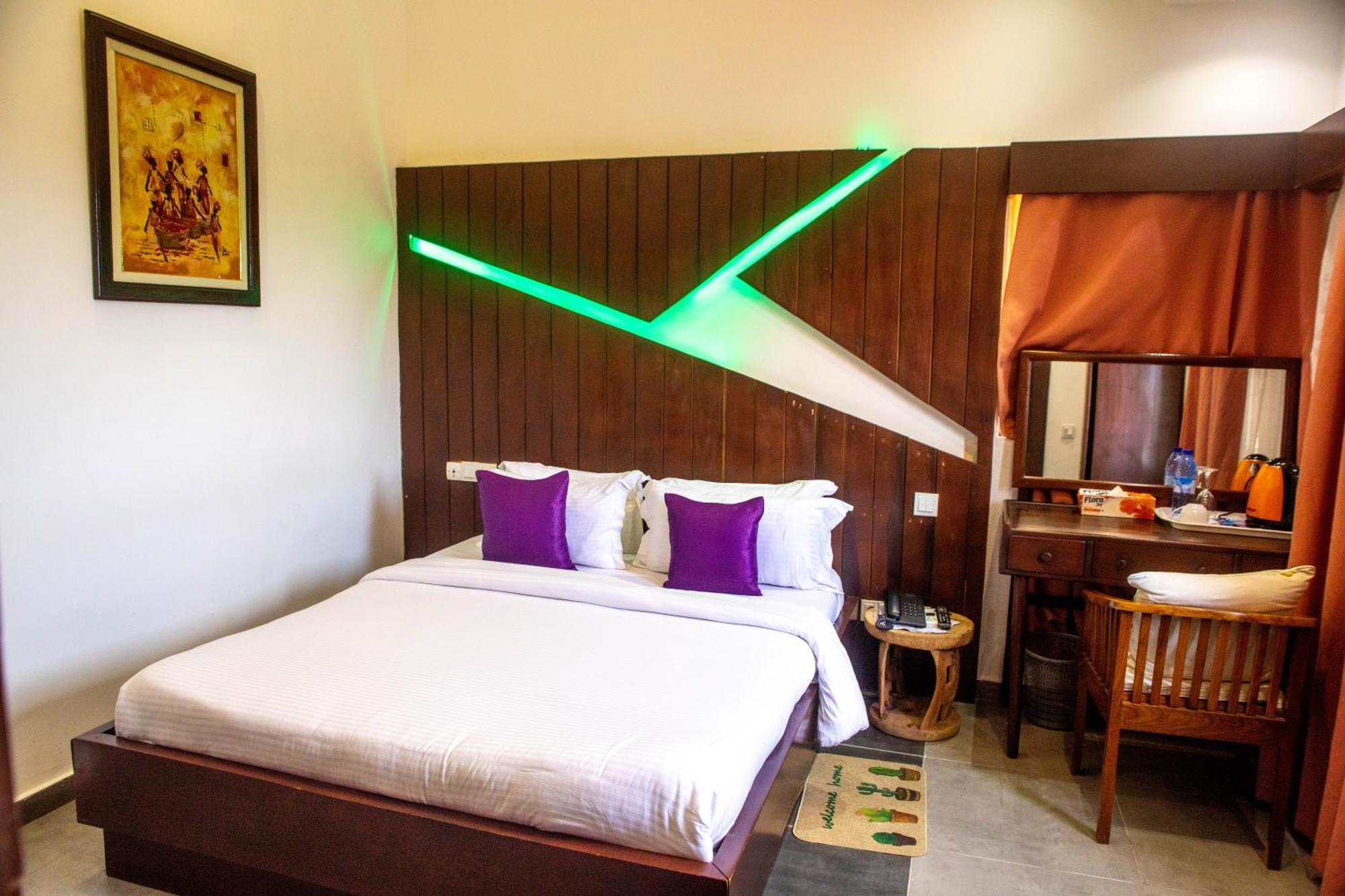 Hotel Les Orchidees Cotonou Quarto foto